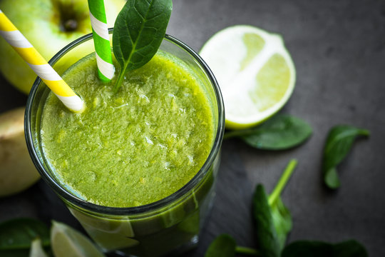 Healthy green spinach smoothie in glass. Clean eating and healthy food.