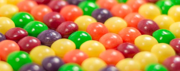 Multi colored pills or bubbles background close up