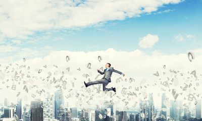 Businessman jumping high