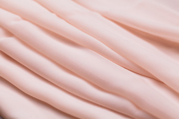 Pink light cloth, fabric, textile with a lot of folds, plaits , creases