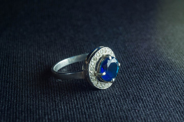 silver ring with a blue stone