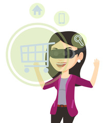 Woman in virtual reality headset shopping online.