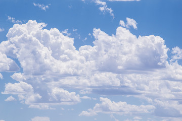 Full sky of fluffy white cumulous clouds