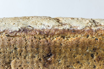 Homemade bread with cranberries and other additives. Polish cuisine. The  crust of rye bread on a light background. .