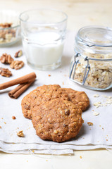 Homemade Oatmeal Cookies with Walnut and Cinnamon on bright background