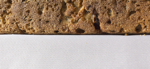 Homemade bread with cranberries and other additives. Polish cuisine. Rye bread on a gray napkin..