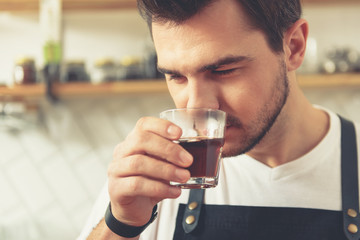 Satisfied male tasting flavored tea