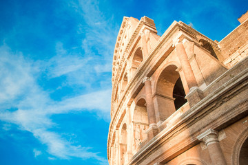 Colosseum or Coliseum background blue sky in Rome, Italy