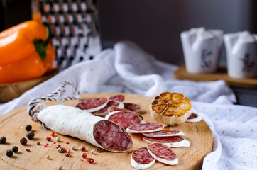 Salami on the kitchen Board, cut into slices