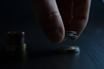 Investment concept, hand put coin to stack