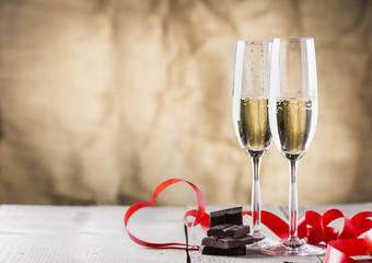 chocolate and two champagne glasses with red ribbon .valentines