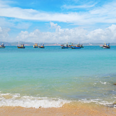 beautiful seascape with fishing boats on the water