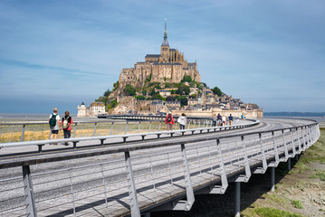 Panoramic view on Mont-Saint-Michel and a road to Abbey , France