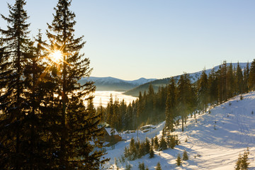 Majestic winter landscape glowing by sunlight in the morning. Dramatic wintry scene. Location Carpathian, Ukraine, Europe. Beauty world. Retro and vintage style, soft filter. Instagram toning effect.