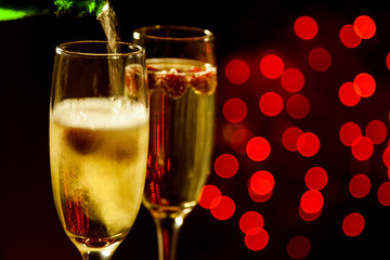 Dark background for valentines day with red circles and champagn