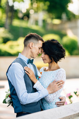 Fototapeta premium Wedding romantic couple hugging on wedding ceremony
