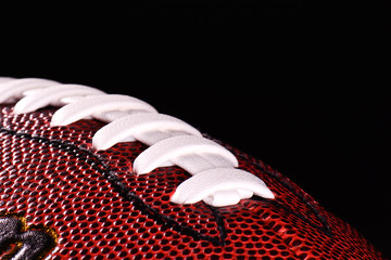  American football ball on black background