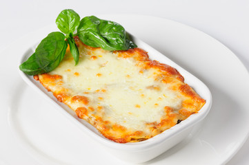 Fresh hot lasagna on white