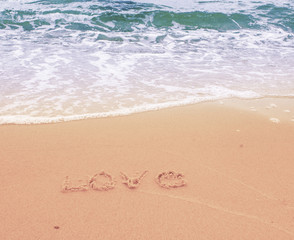 The inscription on the sand. Love. - 135371283