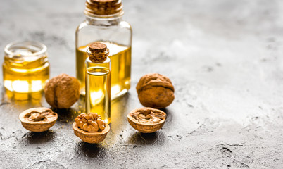 cosmetic and therapeutic walnut oil on dark background