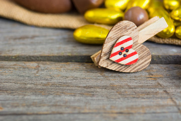 Valentines day wooden heart on old wood table. Holidays card with copy space