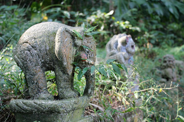 Old stone statue of an elephant in the jungles of Taiwan