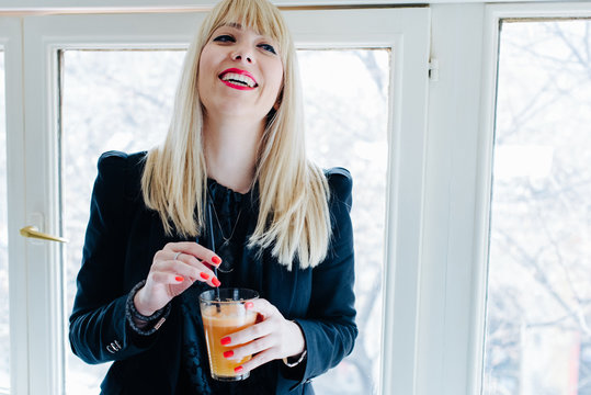 Business woman smiles sincerely to her lapsus lingue.