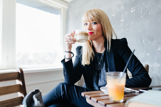 Woman Prepairing To Have A Sip Of Her First Coffee In The Morning.