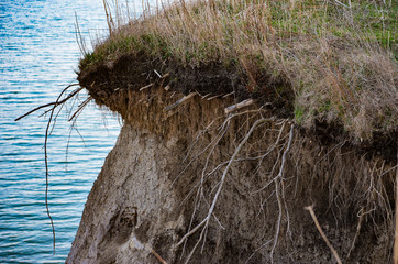 Eroded Cliff Edge Overlooking a Lake