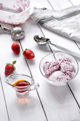 organic homemade ice cream in glass bowl on wooden background