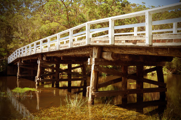 Historic wooden Varney Bridge across Kangaroo Creek at Audley, Royal National Park, Sydney, Australia. Retro toned.