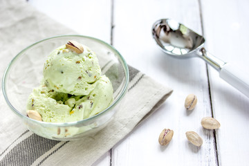 organic homemade ice cream in glass bowl on wooden background
