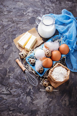 Fototapeta na wymiar Ingredients for baking Easter cake. Milk, butter, eggs, flour