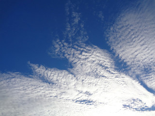 Sunny white clouds on blue sky