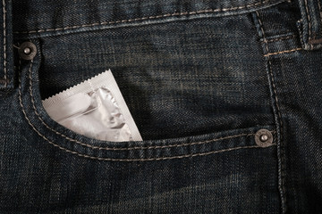 Close up Condoms in the blue jeans pocket, save sex concept