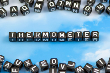 The word Thermometer on the sky background