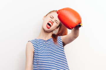 red boxing gloves on the hands of a woman