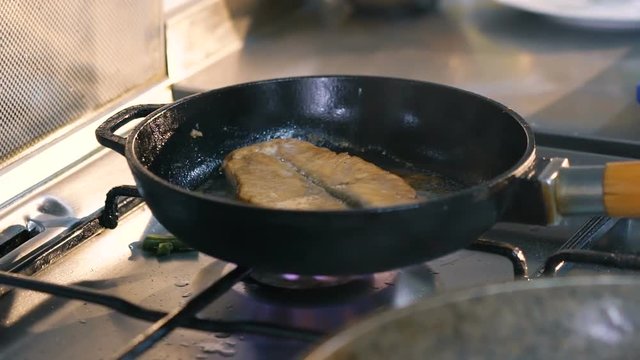 Close up of frying steak
