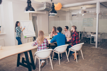 Successful young businesspeople having meeting  in modern office