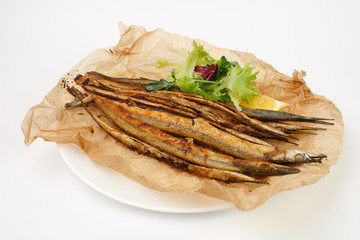 grilled fish with vegetables on a white background