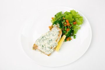 grilled fish with vegetables on a white background