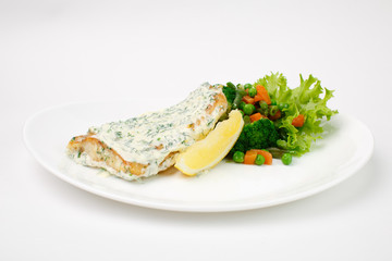 grilled fish with vegetables on a white background