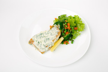 grilled fish with vegetables on a white background