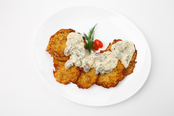 Jewish potato pancakes on white background