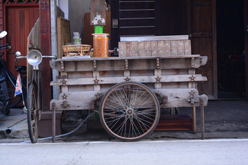 wooden barrow in fron of the store