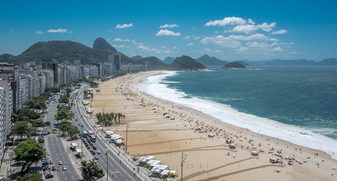 Aerial view of the coast of Copacabana Beach, Forte Duque de Caxias, Sugarloaf Mountain, Atlantic Ocean and blue sky, Rio de Janeiro, Brazil