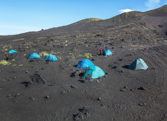 Base volcanologists and tourists near volcano Tolbachik - Kamchatka, Russia