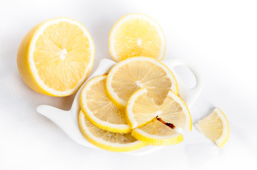 Lemon sliced lies on a plate shaped
