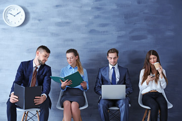 Group of young people waiting for interview indoors