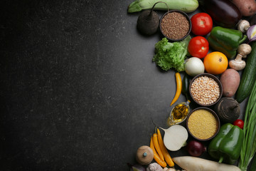 Fresh vegetables on gray background, top view